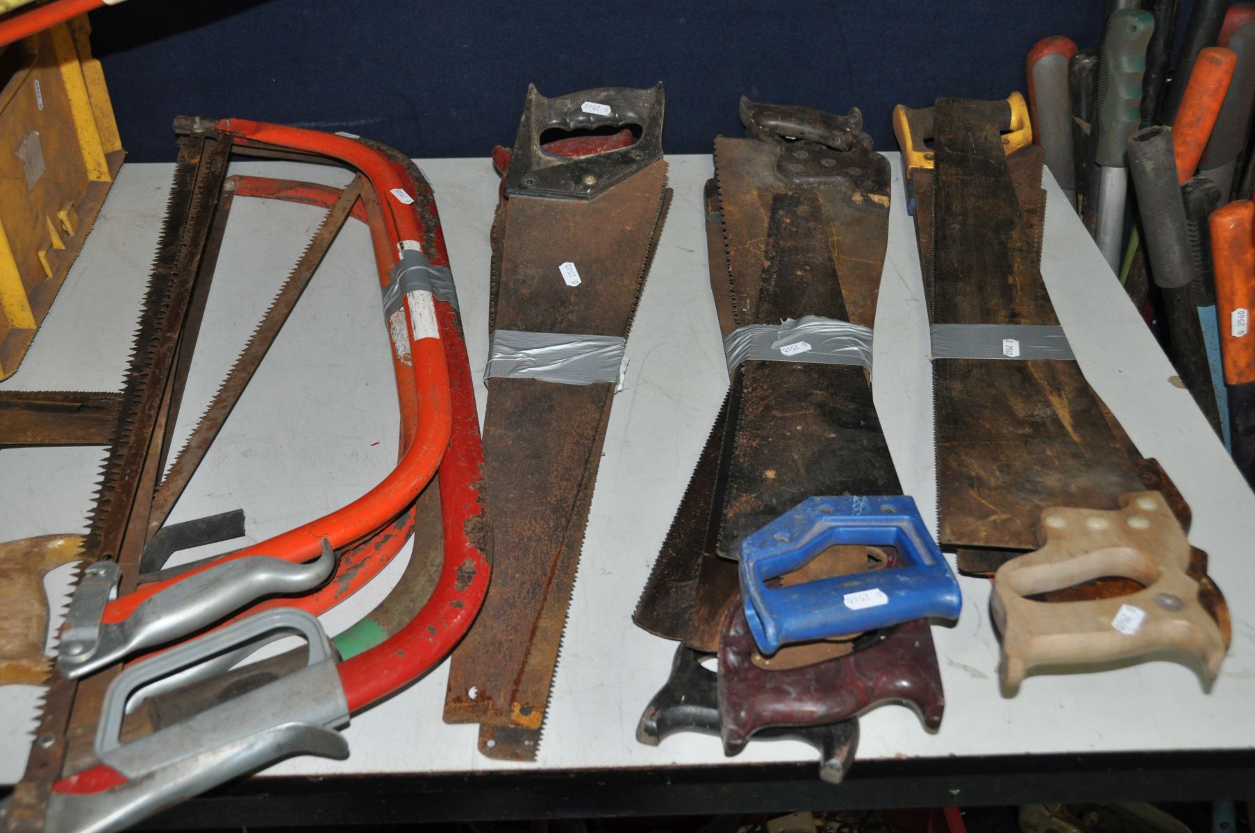 A LARGE QUANTITY OF SAWS AND LAWN EDGE CLIPPERS including vintage and modern cross cut ,rip ,bow - Image 5 of 5