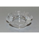 A LALIQUE ST NICHOLAS CLEAR AND FROSTED GLASS ASHTRAY/DISH, the crenellated rim moulded with eight