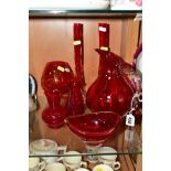 A SMALL GROUP OF RED GLASSWARES, to include a jug, height 21.5cm, an oval shaped bowl, height 7cm,