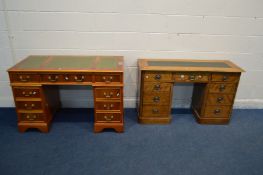 A VICTORIAN SATIN BIRCH KNEE HOLE DESK with a green top and an assortment of seven drawers (later