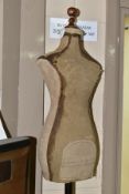 A VINTAGE CHILD SIZED SHOP MANNEQUIN, canvas covered body mounted onto a metal pole on cast metal