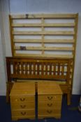 A PINE 4FT6 BED FRAME (complete) with a pair of pine effect three drawer bedside cabinets (3)