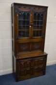 AN OAK DRINKS CABINET/BOOKCASE, width 91cm x depth 46cm x height 194cm (key)