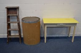 A YELLOW FORMICA TOP TABLE with a single drawer, width 112cm x depth 51cm x height 77cm, together