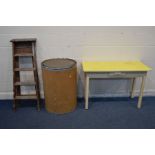 A YELLOW FORMICA TOP TABLE with a single drawer, width 112cm x depth 51cm x height 77cm, together