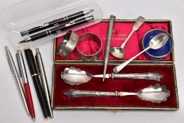 A BOX OF SILVER ITEMS AND PENS, to include a fiddle pattern sauce spoon, with an engraved monogram