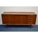 A MID 20TH CENTURY TEAK DANISH STYLE SIDEBOARD, raised back, double sliding doors with circular