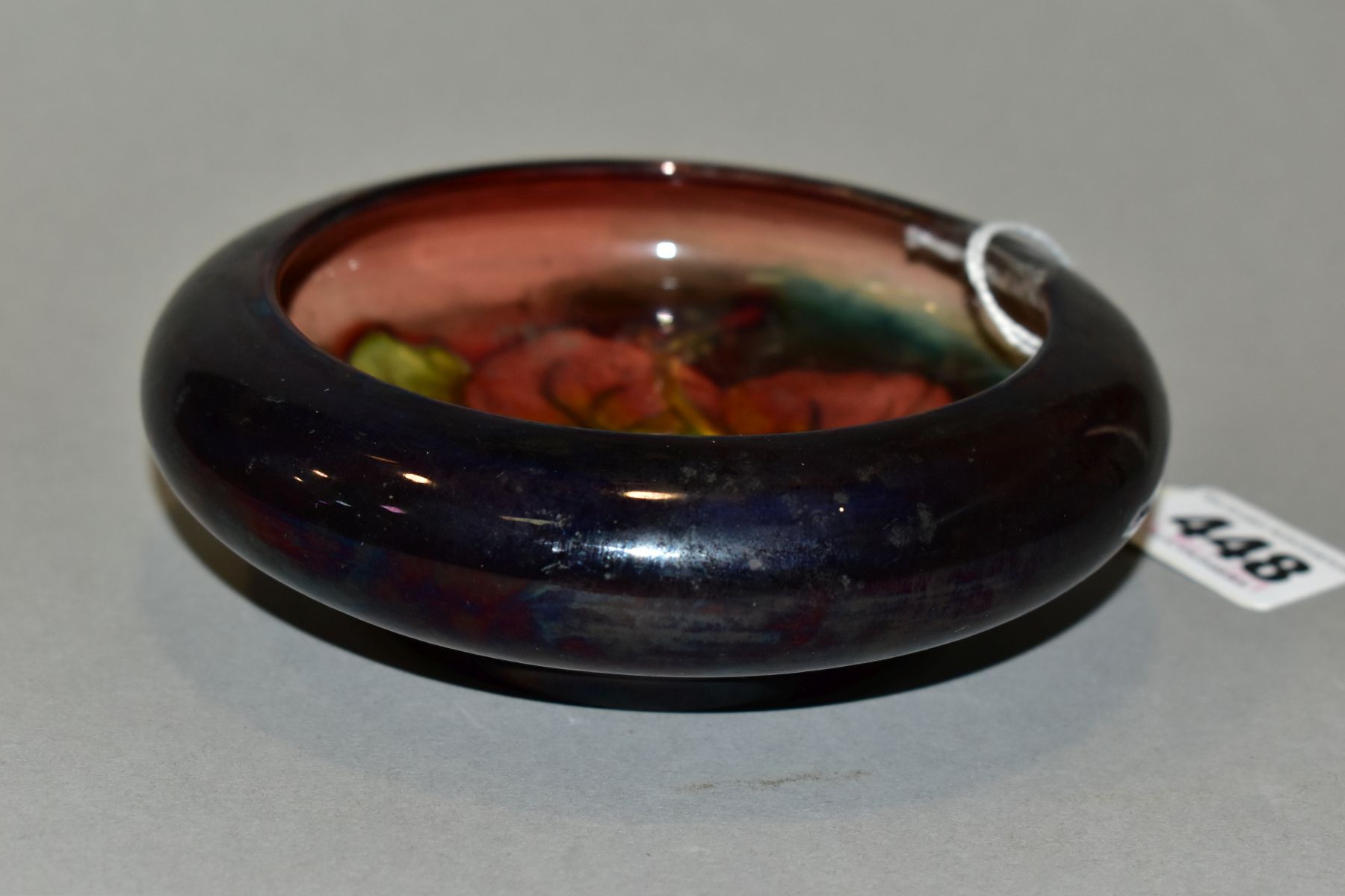 A MOORCROFT POTTERY LIPPED BOWL, Flambe Hibiscus pattern, impressed backstamp, diameter inside lip - Image 4 of 6