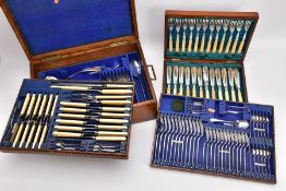 AN EDWARDIAN THREE TIERED OAK CASED CANTEEN OF OLD ENGLISH PATTERN SILVER PLATED CUTLERY for