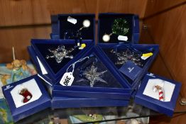 THREE BOXED SWAROVSKI CRYSTAL CHRISTMAS 'SNOWFLAKE' ORNAMENTS, 2005, 2006 and 2008, together with