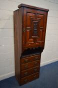AN EDWARDIAN MAHOGANY COMPACTUM WARDOBE SECTION, a large protruding single cupboard door, with