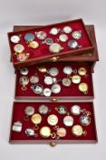 A DISPLAY CASE CONTAINING FORTY QUARTZ POCKET WATCHES, all with various designs and shapes, inside a