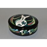 A MOORCROFT POTTERY COVERED BOWL, decorated with stylised birds and foliage by Nicola Slaney, signed