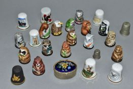 A SET OF FIFTEEN PORCELAIN FRIENDS OF THE FOREST THIMBLES, together with a black basalt thimble '