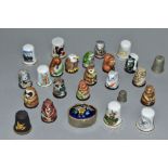 A SET OF FIFTEEN PORCELAIN FRIENDS OF THE FOREST THIMBLES, together with a black basalt thimble '