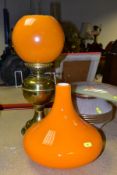 A BRASS OIL LAMP, in working condition with chimney and damaged orange shade, together with a