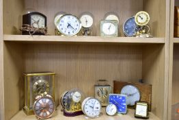 NINETEEN MANTLE AND BEDSIDE CLOCKS, to include four plastic domed rotating pendulum clocks, such