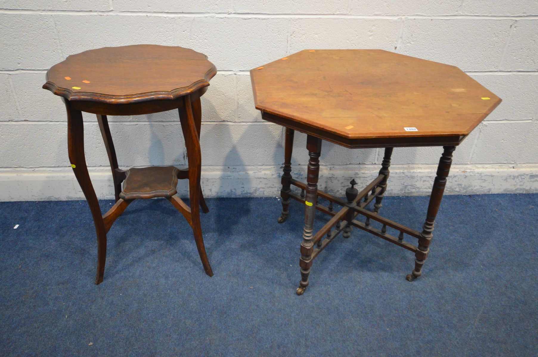 AN EDWARDIAN MAHOGANY OCTAGANAL OCCASSIONAL TABLE, on turned supports united by a central finial, on