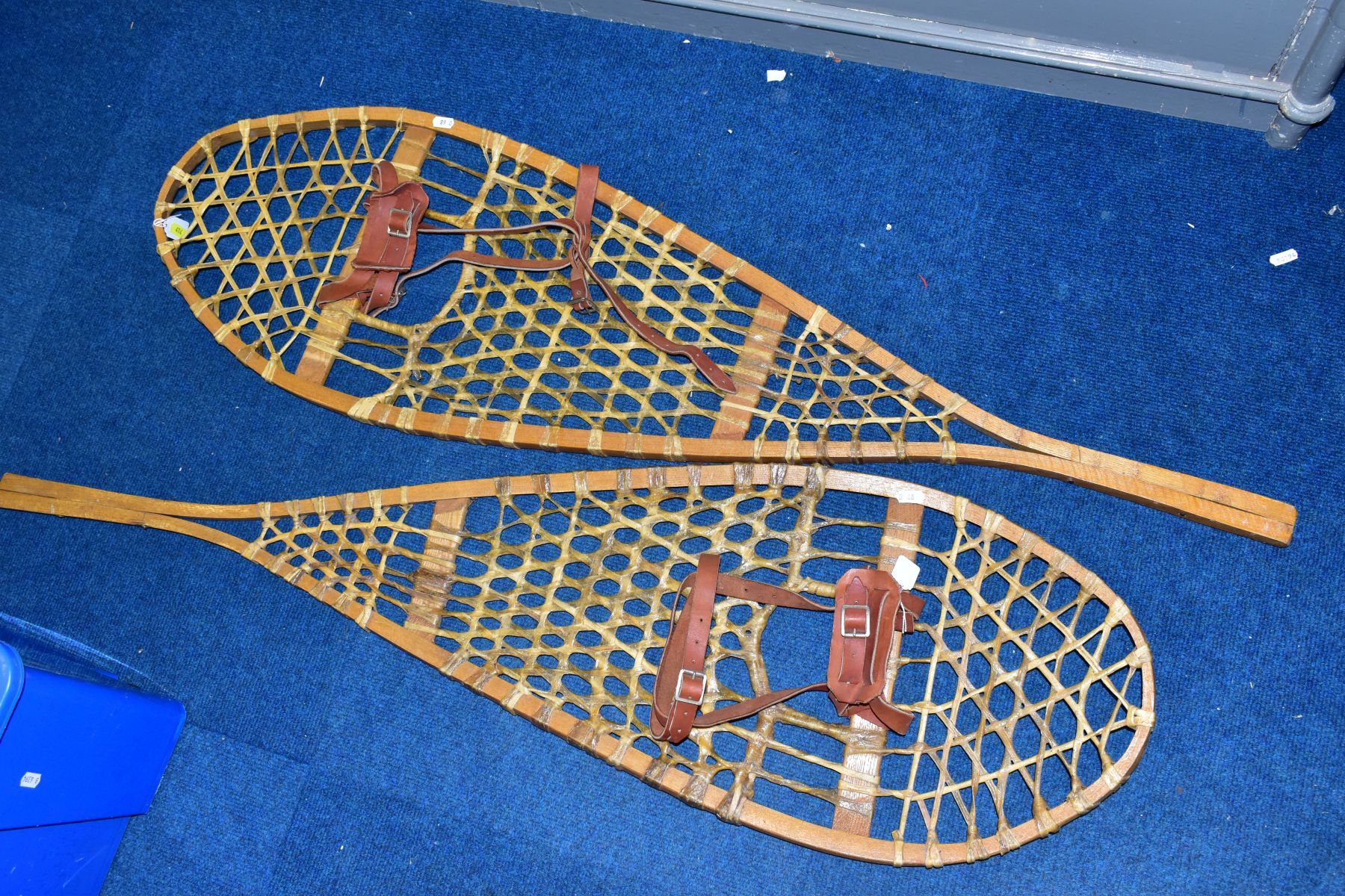 A PAIR OF LATE 20TH CENTURY BENTWOOD AND GUT STRUNG SNOWSHOES, with tan leather straps, length