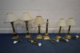 A COLLECTION OF BRASS COLUMN LAMPS, to include a pair of Corinthian column lamps on a stepped