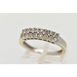 A 9CT WHITE GOLD HALF HOOP DIAMOND RING, designed with two rows of illusion set, single cut