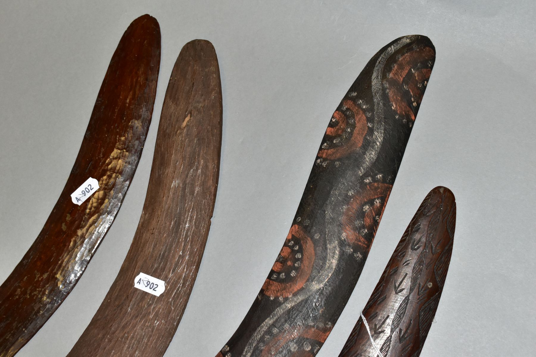 FOUR TRIBAL ART AUSTRALIAN ABORIGINAL BOOMERANGS, to include one carved to the side of arrows, - Image 2 of 9