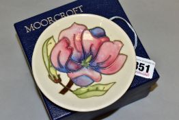 A BOXED MOORCROFT POTTERY PIN DISH, decorated with pink magnolia on a cream ground, painted and