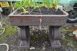 A GLAZED RECTANGULAR PLANTER on twin scrolled supports, later painted, width 62cm x depth 47cm x