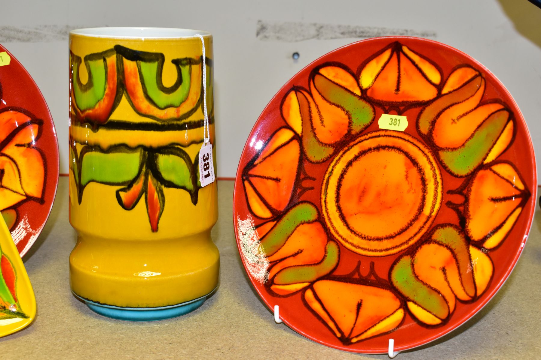 FOUR PIECES OF POOLE POTTERY, abstract designs, comprising two red ground plates, both 25.5cm - Bild 4 aus 8