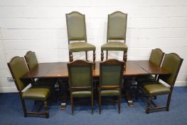 A REPRODUCTION OAK REFECTORY TABLE, with later draw leaves to each end, twin acorn legs united by