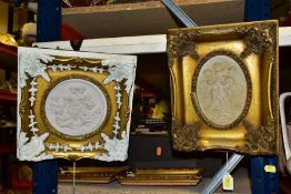 TWO CAST MARBLE PLAQUES IN GILT FRAMES, a circular example of Cherubs singing and playing