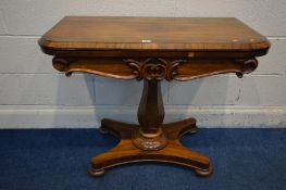 A VICTORIAN ROSEWOOD CARD TABLE, the fold over top enclosing a light green baize games surface,