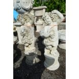 A PAIR OF COMPOSITE PUTTO GARDEN FIGURES, holding a bunch of grapes, height 88cm (chip to bottom rim