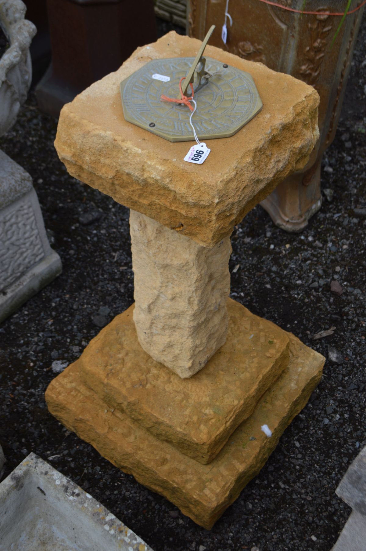 A RED SANDSTONE SUN DIAL, breaks into four sections, height 90cm