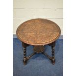 A 1920'S CIRCULAR CARVED OAK CENTRE TABLE, on angled barley twist legs united by bobbin turned