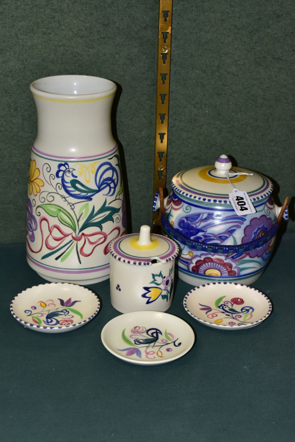 A GROUP OF POOLE POTTERY, comprising a biscuit barrel, Bluebird design, impressed backstamp (one