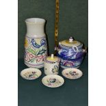 A GROUP OF POOLE POTTERY, comprising a biscuit barrel, Bluebird design, impressed backstamp (one