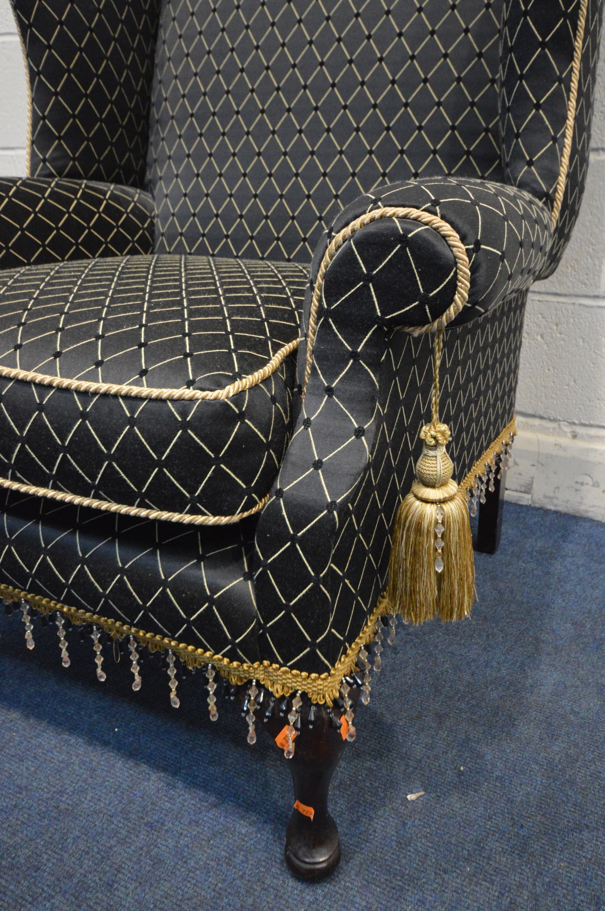 A GEORGIAN STYLE WINGBACK ARMCHAIR, with black ground and patterned upholstery, width 80cm x inner - Image 3 of 3