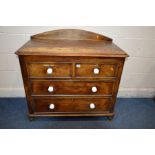 A DISTRESSED VICTORIAN SCUMBLED PINE CHEST OF TWO SHORT OVER TWO LONG, raised arched back, later