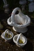 A COMPOSITE GARDEN PLANTER of a woven fruit basket, with a single handle, length 78cm x depth 57cm x