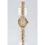 A 9CT GOLD HAND WOUND ROLEX TUDOR LADY'S WRISTWATCH, a round case measuring approximately 15mm in