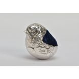 AN EARLY 20TH CENTURY SILVER PIN CUSHION, in the form of a realistically textured hatching chick,