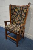 AN ARTS AND CRAFTS OAK ORKNEY CHAIR, black and florally upholstered back and matching removable