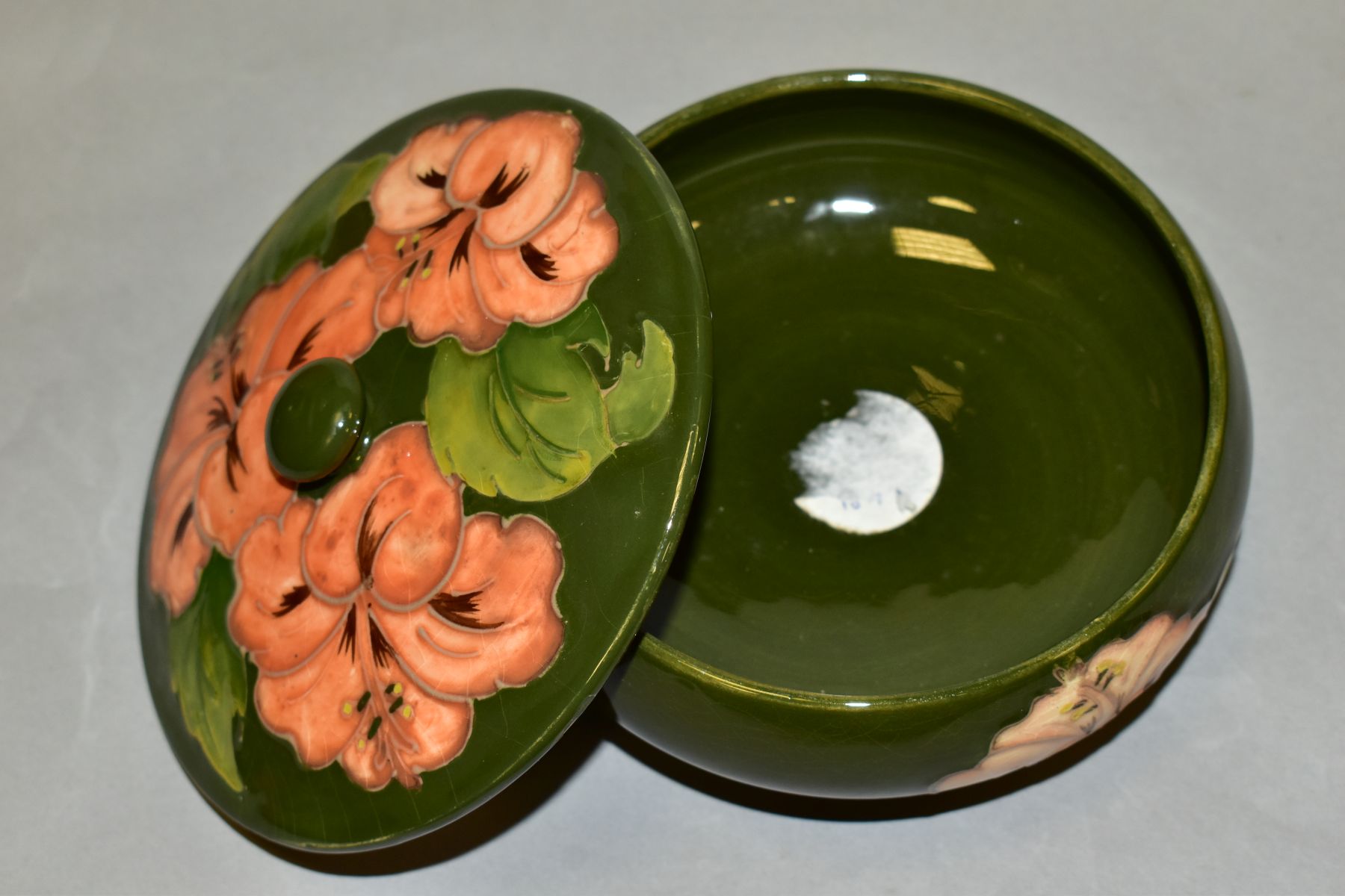 A MOORCROFT POTTERY COVERED POWDER BOWL, Hibiscus pattern on green ground, impressed backstamp and - Image 2 of 4