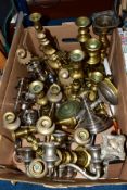 A BOX OF METALWARES, including brass, plated, wooden and chrome candlesticks, candelabrum, a brass