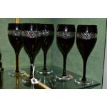 A SET OF FIVE WATERFORD CRYSTAL JOHN ROCHA BLACK CUT WINE GLASSES, all with etched Waterford