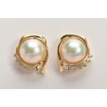A MODERN PAIR OF DIAMOND AND MABE PEARL STUD EARRINGS, post and scroll fitting, round brilliant