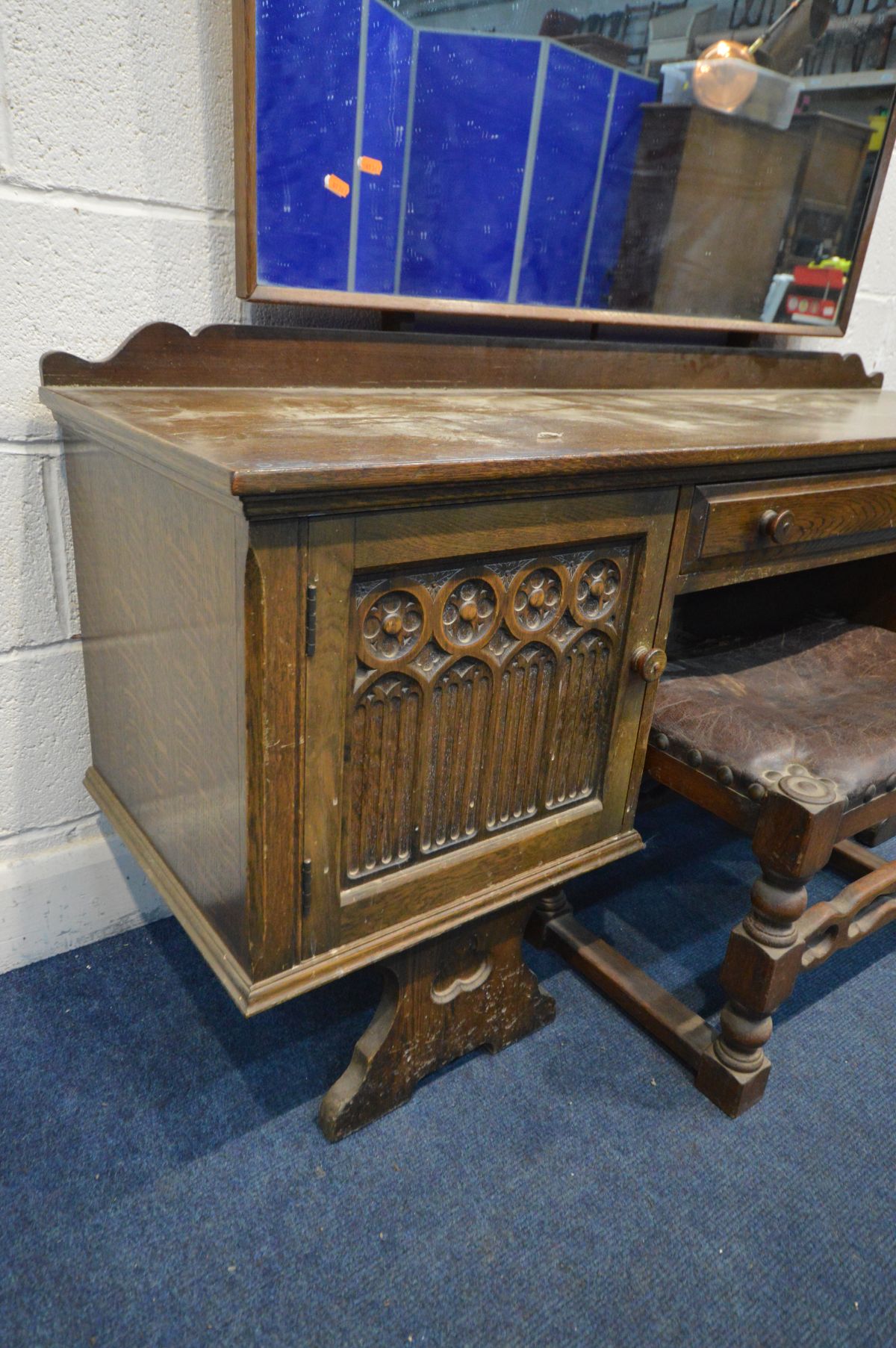 AN OAK GOTHIC DRESSING TABLE with a shaped mirror, two cupboard doors flanking a single drawer, - Image 3 of 5