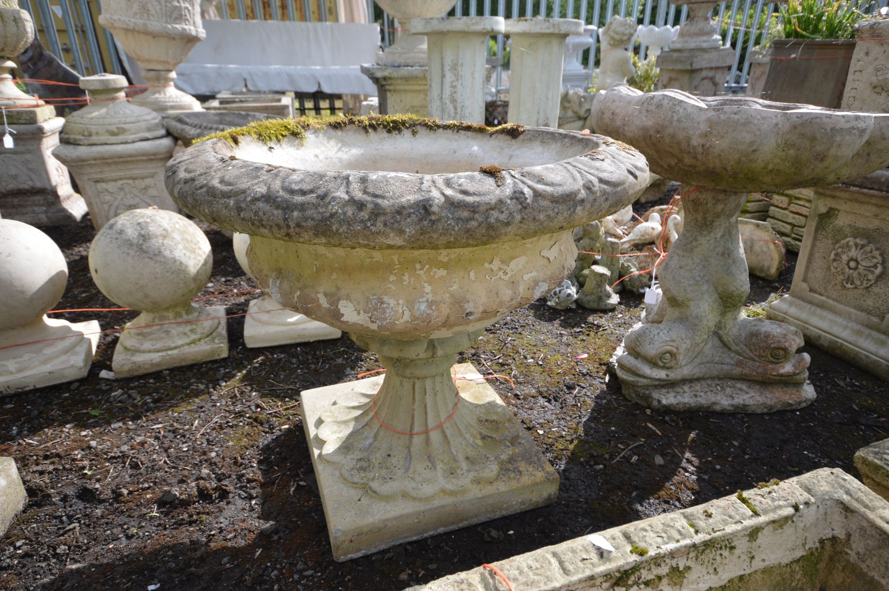 A COMPOSITE GARDEN CAMPANA URN, on a separate base, stamped Sandford stone, diameter 61cm x height