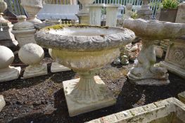 A COMPOSITE GARDEN CAMPANA URN, on a separate base, stamped Sandford stone, diameter 61cm x height